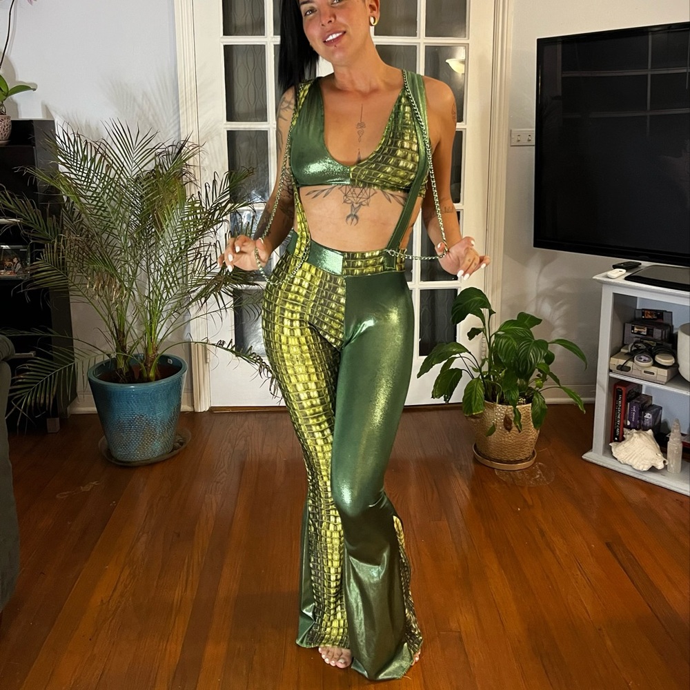 Metallic green outfit with suspenders and top, chains and bell bottoms
